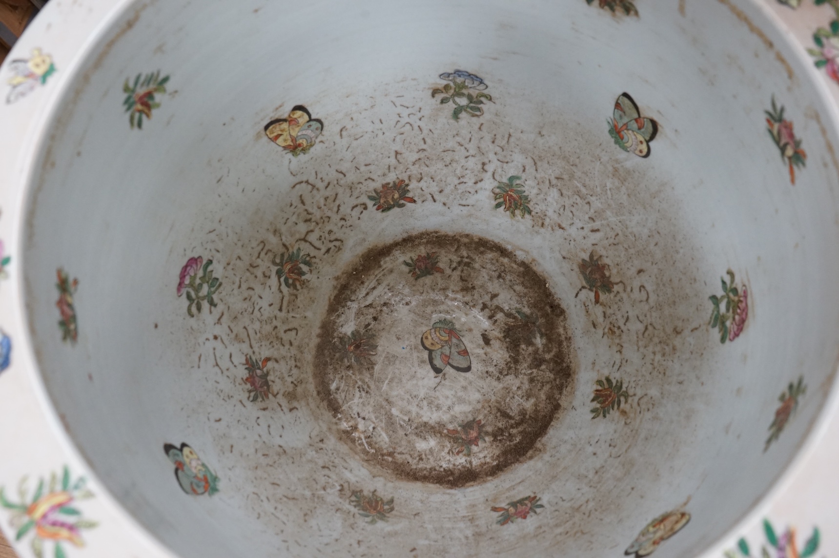 A Chinese famille Rose goldfish bowl enamelled with figures, butterflies and flowers, 41cm in diameter